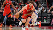 Toronto Raptors forward Jamison Battle steals the ball from Philadelphia 76ers guard Kyle Lowry in the second half at Scotiabank Arena in Toronto on Oct. 25, 2024.