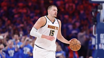Denver Nuggets center Nikola Jokic dribbles down the court against the Oklahoma City Thunder.
