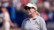Oklahoma coach Patty Gasso talks with an official during a Women's College World Series softball game between the University of Oklahoma Sooners (OU) and the Texas Longhorns at Devon Park in Oklahoma City, Saturday, May 31, 2025. Texas won 4-2.