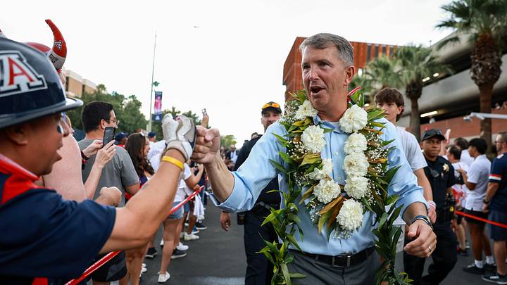 Aug 31, 2024; Tucson, Arizona, USA; Arizona Wildcat head coach Brent Brennan interacts with fans as he walks down the Wildcat Walk before a game against the New Mexico Lobos at Arizona Stadium. Mandatory Credit: Aryanna Frank-Imagn Images