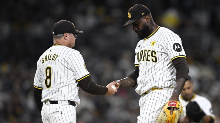 Jun 11, 2024; San Diego, California, USA; San Diego Padres manager Mike Shildt (8) takes the ball from relief pitcher Enyel De Los Santos (62) during a pitching change in the eighth inning against the Oakland Athletics at Petco Park. Mandatory Credit: Orlando Ramirez-USA TODAY Sports