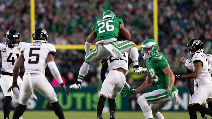 Philadelphia Eagles running back Saquon Barkley (26) leaps backwards over Jacksonville Jaguars cornerback Jarrian Jones (22) at Lincoln Financial Field. 