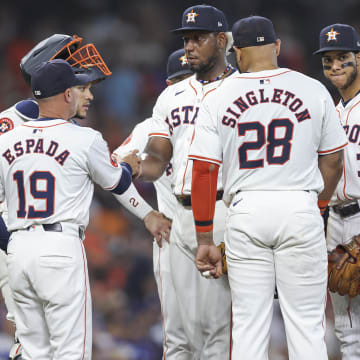 Jul 27, 2024; Houston, Texas, USA; Houston Astros starting pitcher Ronel Blanco (56) hands the ball to manager Joe Espada (19) during a pitching change in the fifth inning against the Los Angeles Dodgers at Minute Maid Park.