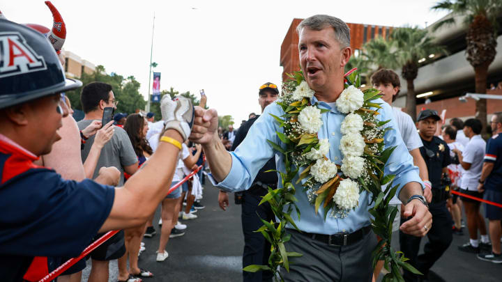 Aug 31, 2024; Tucson, Arizona, USA; Arizona Wildcat head coach Brent Brennan interacts with fans as he walks down the Wildcat Walk before a game against the New Mexico Lobos at Arizona Stadium. 