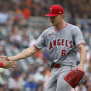 Aug 29, 2024; Detroit, Michigan, USA;  Los Angeles Angels catcher Matt Thaiss (21) and pitcher Jack Kochanowicz (64) celebrates after the sixth inning against the Detroit Tigers at Comerica Park. Mandatory Credit: Rick Osentoski-Imagn Images