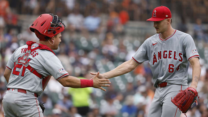 Aug 29, 2024; Detroit, Michigan, USA;  Los Angeles Angels catcher Matt Thaiss (21) and pitcher Jack Kochanowicz (64) celebrates after the sixth inning against the Detroit Tigers at Comerica Park. Mandatory Credit: Rick Osentoski-Imagn Images