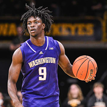 Feb 22, 2025; Iowa City, Iowa, USA; Washington Huskies guard Zoom Diallo (9) controls the ball against the Iowa Hawkeyes during the first half at Carver-Hawkeye Arena.