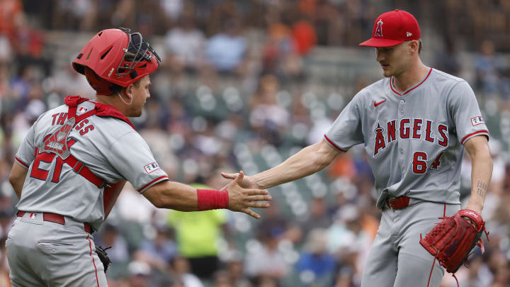 Aug 29, 2024; Detroit, Michigan, USA;  Los Angeles Angels catcher Matt Thaiss (21) and pitcher Jack Kochanowicz (64) celebrates after the sixth inning against the Detroit Tigers at Comerica Park. Mandatory Credit: Rick Osentoski-USA TODAY Sports