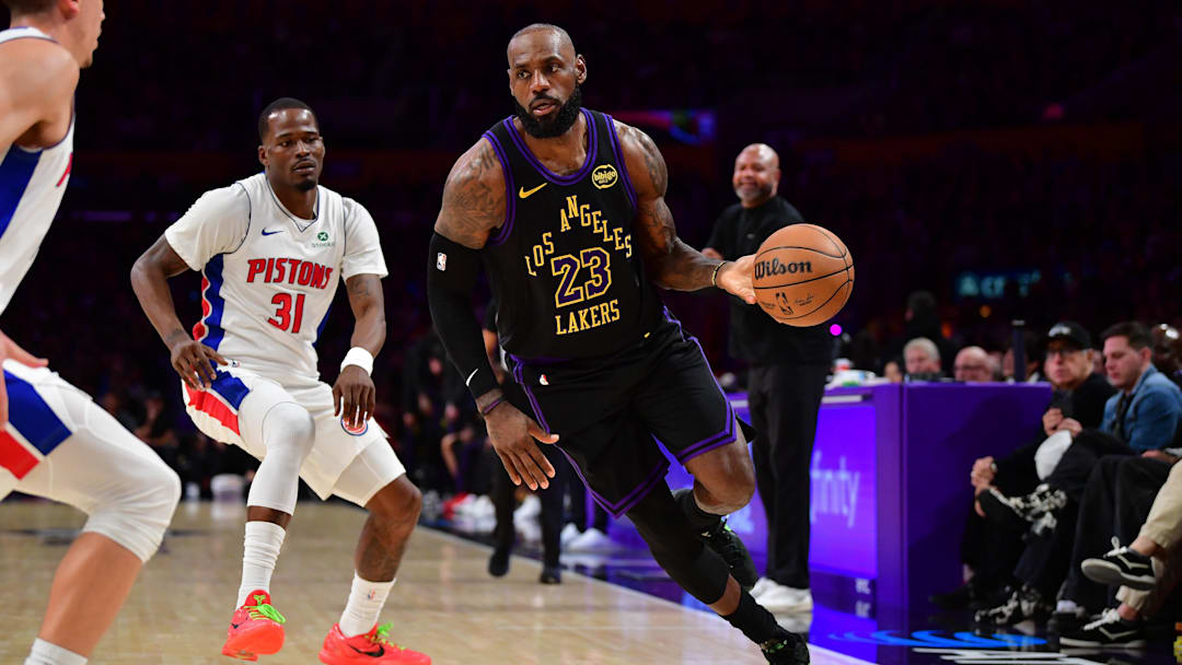 Dec 30, 2025; Los Angeles, California, USA; Los Angeles Lakers forward LeBron James (23) moves the ball ahead of Detroit Pistons guard Javonte Green (31) during the second half at Crypto.com Arena. Mandatory Credit: Gary A. Vasquez-Imagn Images