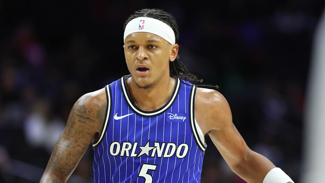 Oct 10, 2025; Philadelphia, Pennsylvania, USA; Orlando Magic forward Paolo Banchero (5) dribbles the ball against the Philadelphia 76ers during the third quarter at Xfinity Mobile Arena. Mandatory Credit: Bill Streicher-Imagn Images