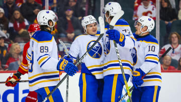 Mar 24, 2024; Calgary, Alberta, CAN; Buffalo Sabres right wing JJ Peterka (77) celebrates his goal with teammates against the Calgary Flames during the third period at Scotiabank Saddledome. Mandatory Credit: Sergei Belski-USA TODAY Sports