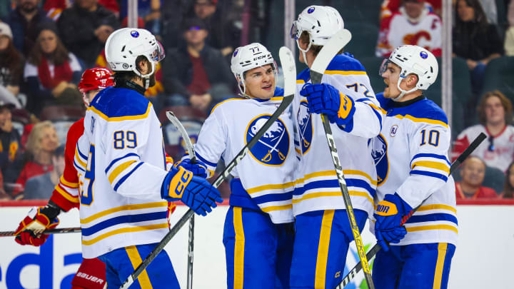 Mar 24, 2024; Calgary, Alberta, CAN; Buffalo Sabres right wing JJ Peterka (77) celebrates his goal with teammates against the Calgary Flames during the third period at Scotiabank Saddledome. Mandatory Credit: Sergei Belski-USA TODAY Sports