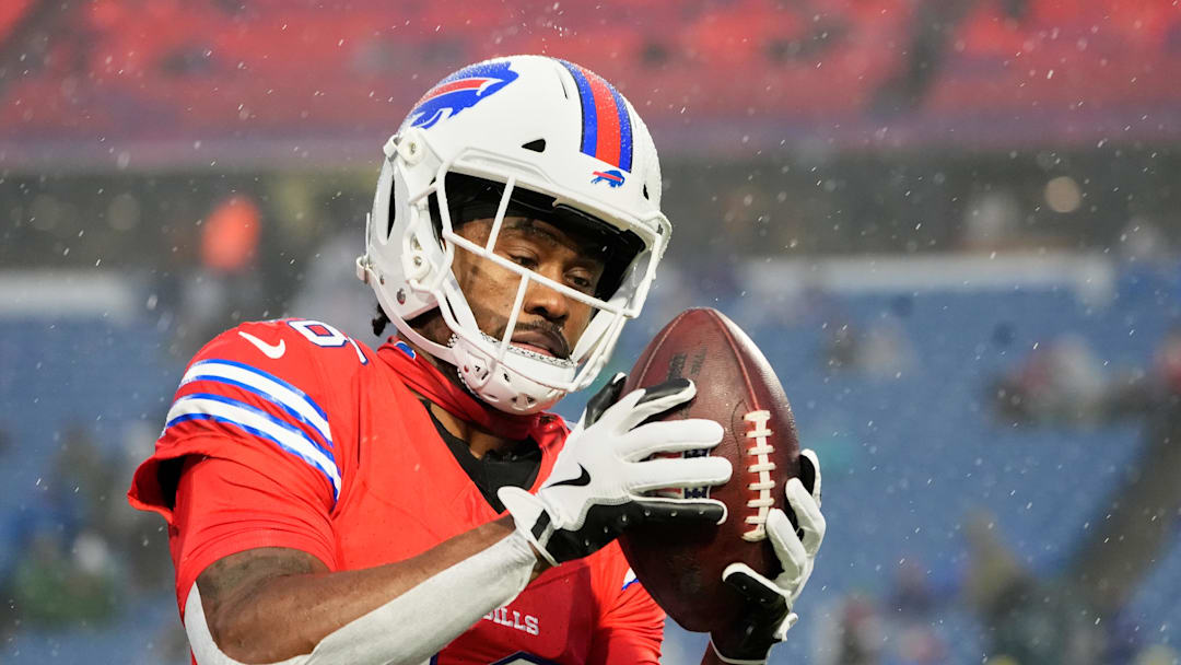 Dec 28, 2025; Orchard Park, New York, USA; Buffalo Bills wide receiver Brandin Cooks (18) warms up in the rain before the game against the Philadelphia Eagles at Highmark Stadium. Mandatory Credit: Gregory Fisher-Imagn Images