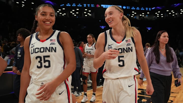 Dec 7, 2024; Brooklyn, New York, USA; Connecticut Huskies guard Azzi Fudd (35) and Connecticut Huskies guard Paige Bueckers (5) celebrate after the game against the Louisville Cardinals at Barclays Center. Dec 7, 2024; Brooklyn, New York, USA; Connecticut Huskies guard Azzi Fudd (35) and Connecticut Huskies guard Paige Bueckers (5) celebrate after the game against the Louisville Cardinals at Barclays Center.