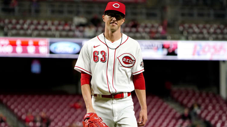 Cincinnati Reds relief pitcher Phillip Diehl (63) smiles as he walks back to the dugout.