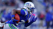 Nov 30, 2025; Seattle, Washington, USA; Seattle Seahawks wide receiver Rashid Shaheed (22) runs the ball during the second half against the Minnesota Vikings at Lumen Field. Mandatory Credit: Kevin Ng-Imagn Images