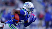 Nov 30, 2025; Seattle, Washington, USA; Seattle Seahawks wide receiver Rashid Shaheed (22) runs the ball during the second half against the Minnesota Vikings at Lumen Field.