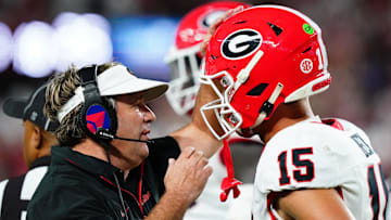 Sep 28, 2024; Tuscaloosa, Alabama, USA;  Georgia Bulldogs head coach Kirby Smart talks with quarterback Carson Beck (15) during the first half against the Alabama Crimson Tide at Bryant-Denny Stadium. Mandatory Credit: John David Mercer-Imagn Images