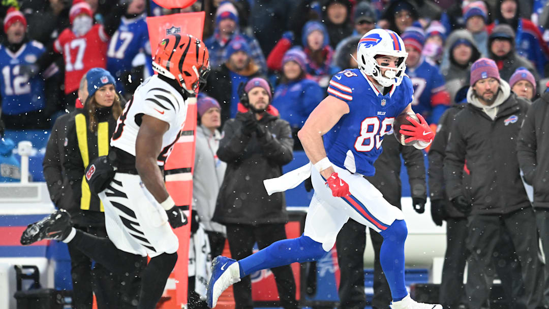 Dec 7, 2025; Orchard Park, New York, USA; Buffalo Bills tight end Dawson Knox (88) runs with the ball in the second half against against the Cincinnati Bengals at Highmark Stadium. Mandatory Credit: Mark Konezny-Imagn Images