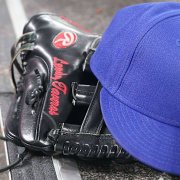 Jul 26, 2024; Toronto, Ontario, CAN; The hat and glove of Texas Rangers fielder Leody Taveras (3) during a game against the Toronto Blue Jays at Rogers Centre. 