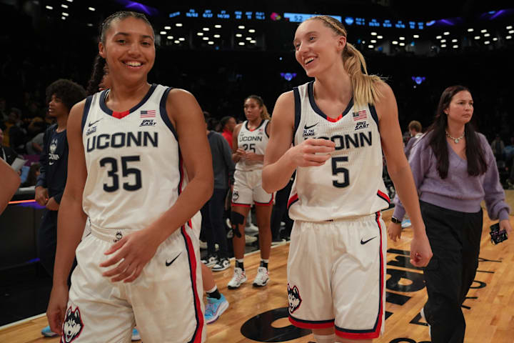 UConn Huskies guards Azzi Fudd and Paige Bueckers celebrate after the game against the Louisville Cardinals.