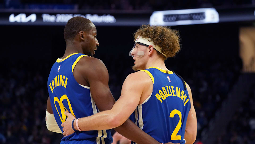 Oct 30, 2024; San Francisco, California, USA; Golden State Warriors forward Jonathan Kuminga (00) huddles with guard Brandin Podziemski (2) during the game against New Orleans Pelicans during the fourth quarter at Chase Center. Mandatory Credit: David Gonzales-Imagn Images