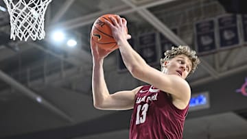 Jan 18, 2025; Spokane, Washington, USA; Santa Clara Broncos center Christoph Tilly (13) rebounds the ball against the Gonzaga Bulldogs in the first half at McCarthey Athletic Center. Mandatory Credit: James Snook-Imagn Images