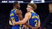 Oct 30, 2024; San Francisco, California, USA; Golden State Warriors forward Jonathan Kuminga (00) huddles with guard Brandin Podziemski (2) during the game against New Orleans Pelicans during the fourth quarter at Chase Center. Mandatory Credit: David Gonzales-Imagn Images
