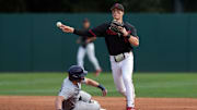 Mar 1, 2025; Stanford, CA, USA; Stanford Cardinal second baseman Jimmy Nati (right) throws the ball to first base after forcing out Xavier Musketeers first baseman Connor Misch (left) during the third inning at Sunken Diamond. Mandatory Credit: Darren Yamashita-Imagn Images