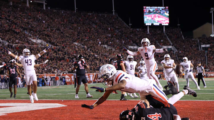Sep 28, 2024; Salt Lake City, Utah, USA; Arizona Wildcats defensive back Tacario Davis (1) defends a fourth down pass intended for Utah Utes tight end Caleb Lohner (84) during the second quarter at Rice-Eccles Stadium. Mandatory Credit: Rob Gray-Imagn Images