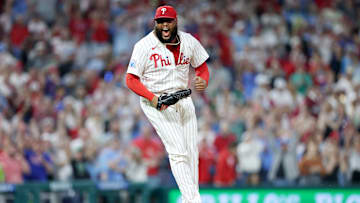 Phillies' José shuts the door in the eighth inning after loaded the bases and social media took notice of a fan watching every pitch.