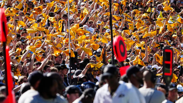 Colorado Buffaloes fans wave towels against the Nebraska Cornhuskers in the first quarter at Folsom Field. 