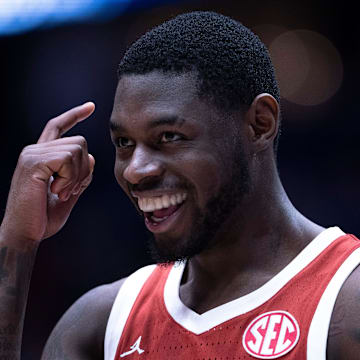 Oklahoma Sooners guard Duke Miles (15) reacts to his late-game play against the Georgia Bulldogs during their first round game of the SEC Men's Basketball Tournament at Bridgestone Arena in Nashville, Tenn., Wednesday, March 12, 2025. Instead of grabbing the ball that was rolling toward their goal, Miles let it go and forced the Georgia Bulldogs player to grab it for a backcourt violation.