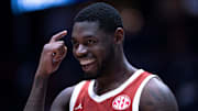 Oklahoma Sooners guard Duke Miles (15) reacts to his late-game play against the Georgia Bulldogs during their first round game of the SEC Men's Basketball Tournament at Bridgestone Arena in Nashville, Tenn., Wednesday, March 12, 2025. Instead of grabbing the ball that was rolling toward their goal, Miles let it go and forced the Georgia Bulldogs player to grab it for a backcourt violation.