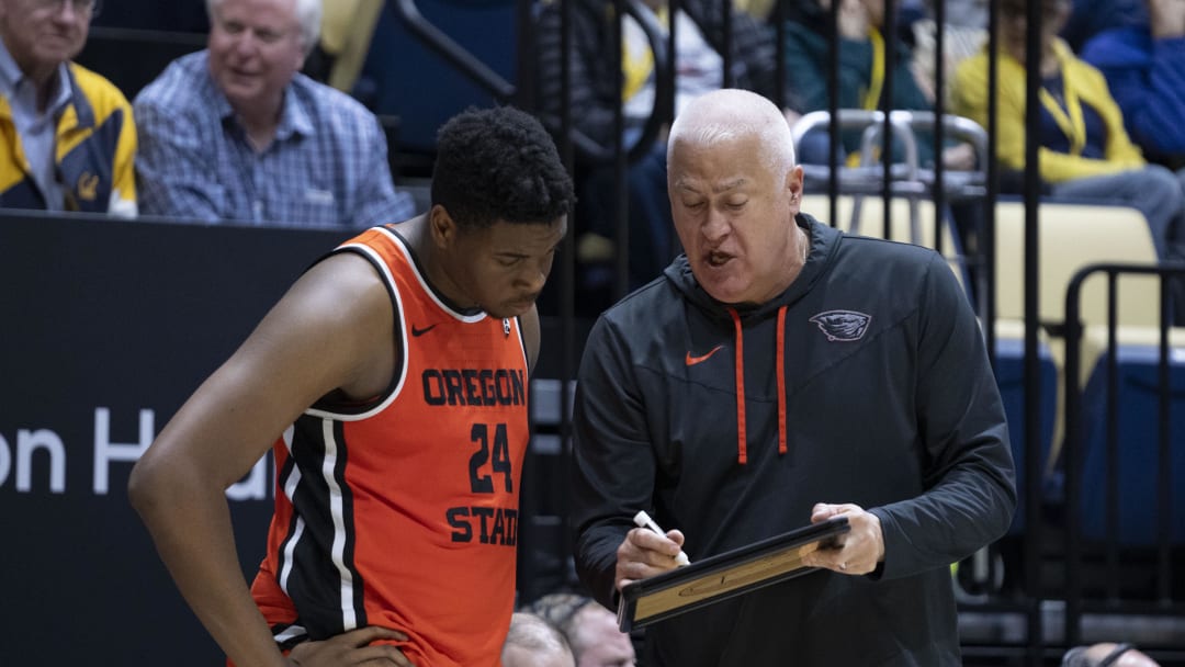 February 22, 2024; Berkeley, California, USA; Oregon State Beavers head coach Wayne Tinkle (right) instructs center KC Ibekwe (24) against the California Golden Bears during the second half at Haas Pavilion. Mandatory Credit: Kyle Terada-USA TODAY Sports