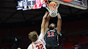 Jan 28, 2025; Salt Lake City, Utah, USA; Cincinnati Bearcats forward Arrinten Page (22) dunks the ball against Utah Utes forward Zach Keller (32) during the first half at Jon M. Huntsman Center. Mandatory Credit: Rob Gray-Imagn Images