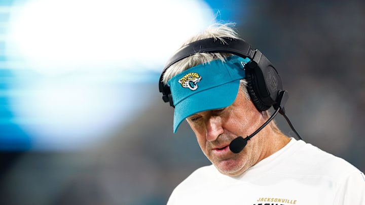 Aug 17, 2024; Jacksonville, Florida, USA; Jacksonville Jaguars head coach Doug Pederson (teal hat) looks on during the second quarter against the Tampa Bay Buccaneers at EverBank Stadium. Mandatory Credit: Douglas DeFelice-Imagn Images