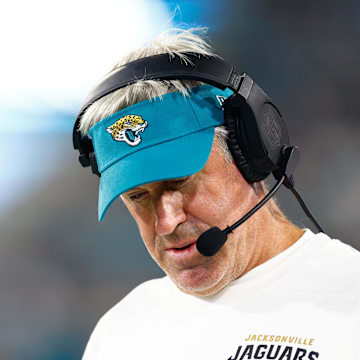 Aug 17, 2024; Jacksonville, Florida, USA; Jacksonville Jaguars head coach Doug Pederson (teal hat) looks on during the second quarter against the Tampa Bay Buccaneers at EverBank Stadium. Mandatory Credit: Douglas DeFelice-Imagn Images