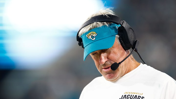 Aug 17, 2024; Jacksonville, Florida, USA; Jacksonville Jaguars head coach Doug Pederson (teal hat) looks on during the second quarter against the Tampa Bay Buccaneers at EverBank Stadium. Mandatory Credit: Douglas DeFelice-Imagn Images