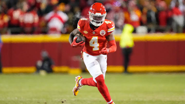 Jan 13, 2024; Kansas City, Missouri, USA; Kansas City Chiefs wide receiver Rashee Rice (4) runs the ball against the Miami Dolphins during the second half of the 2024 AFC wild card game at GEHA Field at Arrowhead Stadium.