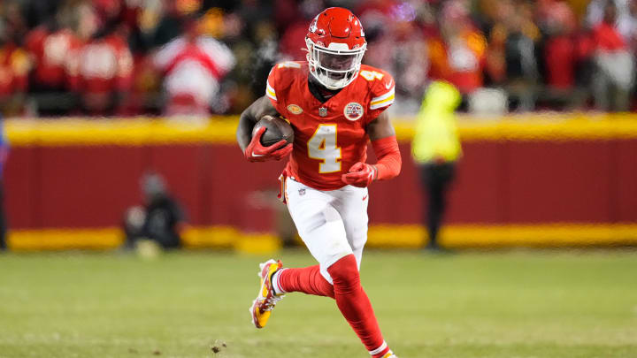 Jan 13, 2024; Kansas City, Missouri, USA; Kansas City Chiefs wide receiver Rashee Rice (4) runs the ball against the Miami Dolphins during the second half of the 2024 AFC wild card game at GEHA Field at Arrowhead Stadium. Mandatory Credit: Jay Biggerstaff-USA TODAY Sports