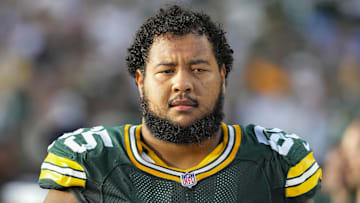 Sep 7, 2025; Green Bay, Wisconsin, USA;  Green Bay Packers guard Aaron Banks (65) during the game against the Detroit Lions at Lambeau Field.