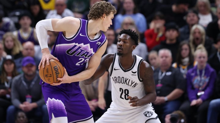 Dec 18, 2023; Salt Lake City, Utah, USA; Utah Jazz forward Lauri Markkanen (23) looks to drive against Brooklyn Nets forward Dorian Finney-Smith (28) during the fourth quarter at Delta Center. Mandatory Credit: Rob Gray-USA TODAY Sports