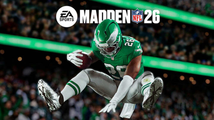 A football player in a green jersy leaping over someone