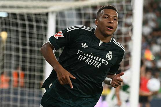 Kylian Mbappé scoring.