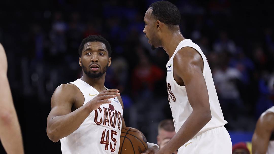 May 13, 2026; Detroit, Michigan, USA; Cleveland Cavaliers guard Donovan Mitchell (45) and center Evan Mobley (4) celebrate after the game gainst the Detroit Pistons during game five of the second round of the 2026 NBA Playoffs at Little Caesars Arena. Mandatory Credit: Rick Osentoski-Imagn Images