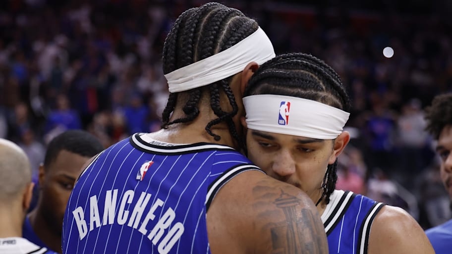 Orlando Magic forward Paolo Banchero hugs guard Anthony Black after the Game 7 loss against the Detroit Pistons.