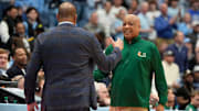 Mar 1, 2025; Chapel Hill, North Carolina, USA;  North Carolina Tar Heels head coach Hubert Davis with Miami (Fl) Hurricanes head coach Bill Courtney at the end of the game at Dean E. Smith Center. Mandatory Credit: Bob Donnan-Imagn Images