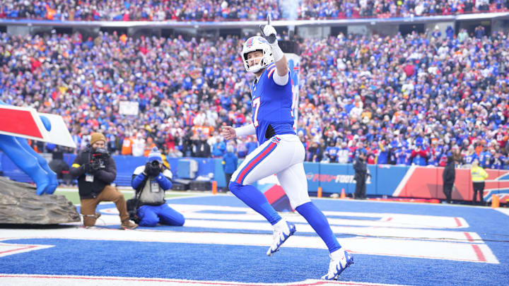 Buffalo Bills quarterback Josh Allen takes the field prior to a game against the Denver Broncos in an AFC wild-card round. Buffalo Bills quarterback Josh Allen takes the field prior to a game against the Denver Broncos in an AFC wild-card round.