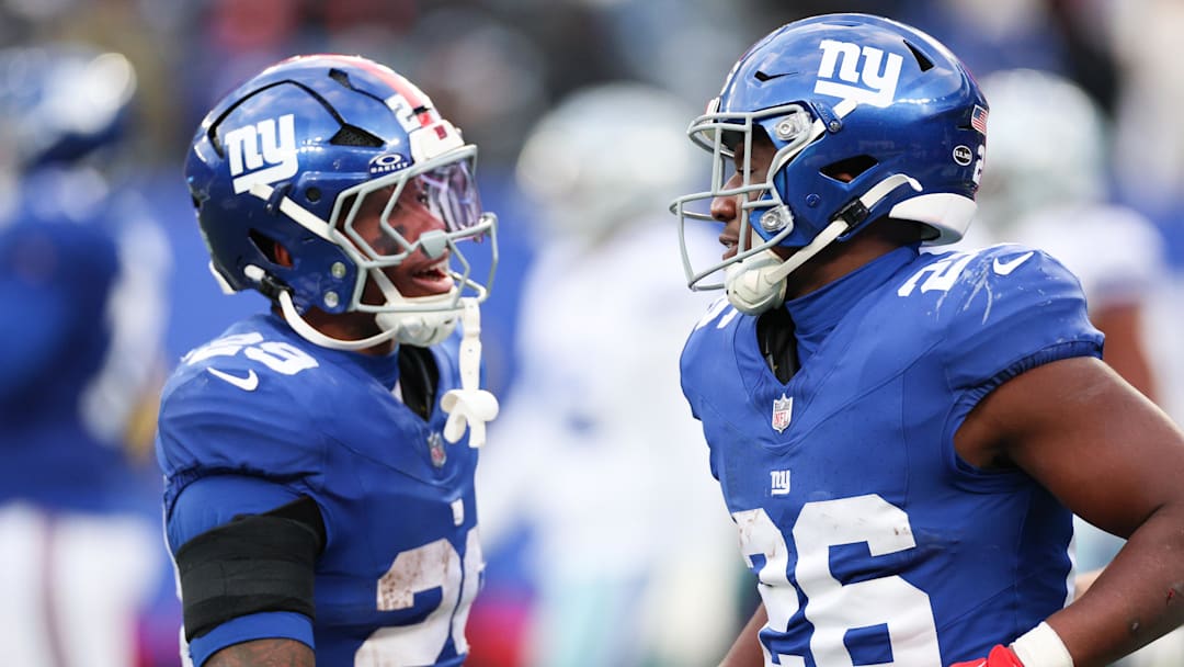 Jan 4, 2026; East Rutherford, New Jersey, USA; New York Giants running back Devin Singletary (26) celebrates with New York Giants running back Tyrone Tracy Jr. (29) after scoring a touchdown during the fourth quarter against the Dallas Cowboys at MetLife Stadium.  